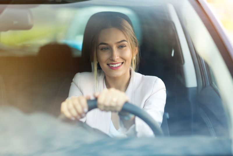 young woman driving car