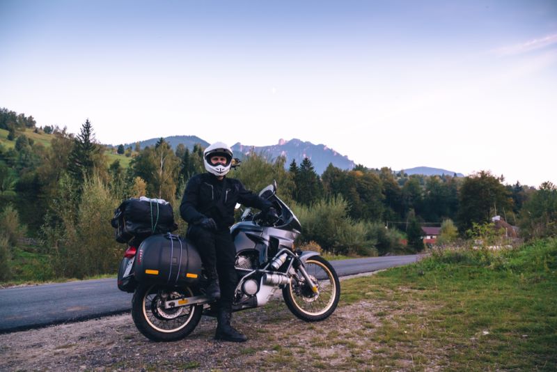 motorcycle rider on the side of the road