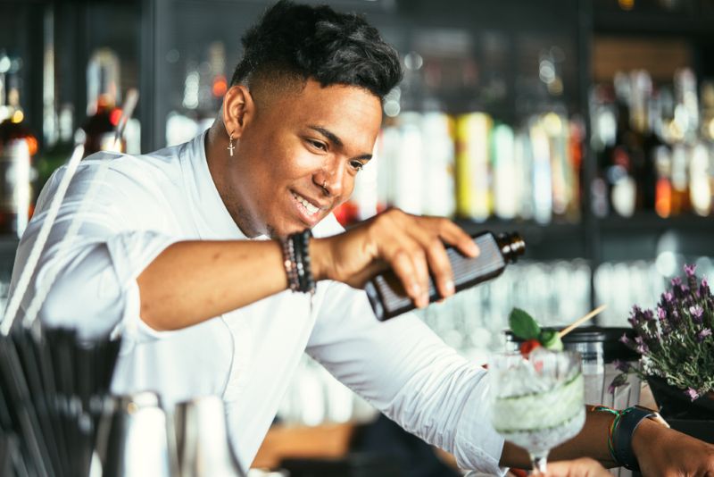 bartender serving a cocktail